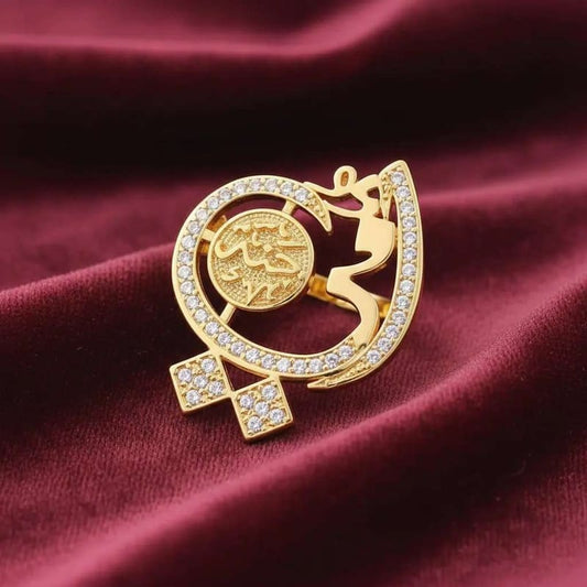 Arabic Words Ring in Gold finish, with cubic zirconia stone on stones on a maroon background