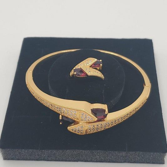 Arrow Bangle & Ring Set in Gold finish, with cubic zirconia stone on a neutral background