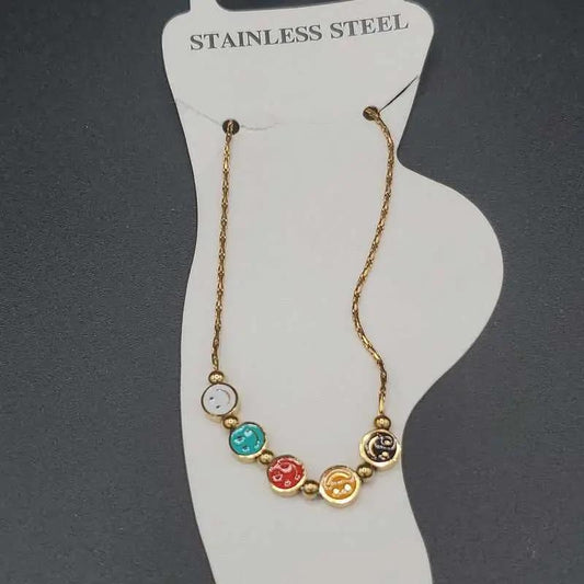 Classic Happy Face Anklet in Gold finish on a neutral background