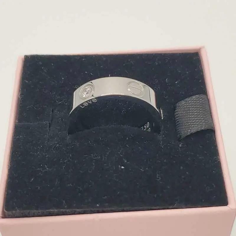 Classic Ring in Gold finish, with cubic zirconia stone on a neutral background