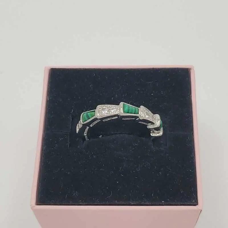 Classic Silver Ring in Silver finish, with cubic zirconia stone on embellished segments