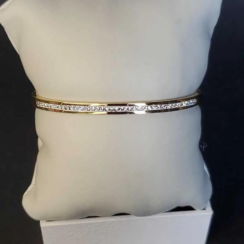 Exquisite Lovely Bangle in Gold finish, with cubic zirconia stone on stones