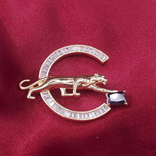 Gold Leopard Brooch in Gold finish, with cubic zirconia stone on stones on a C-shaped frame