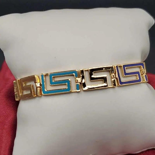 Greek Key Bracelet in Gold finish on a neutral background