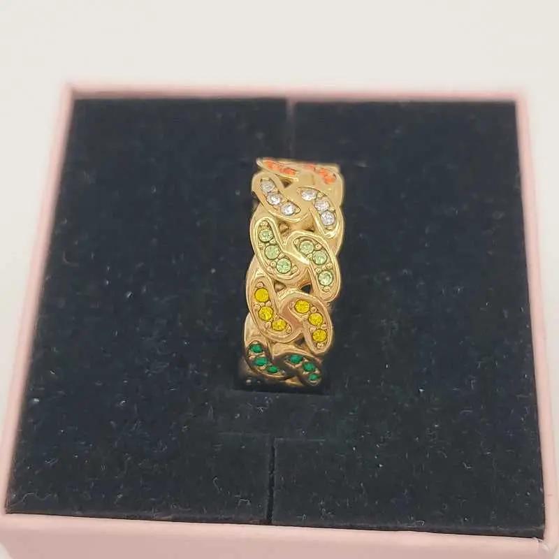 Lustrous Colorful Ring in Gold finish, with cubic zirconia stone on stones