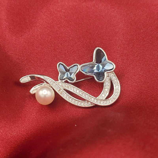 Modern Blue Butterfly Brooch in Silver finish, with cubic zirconia stone on and clear pear stone