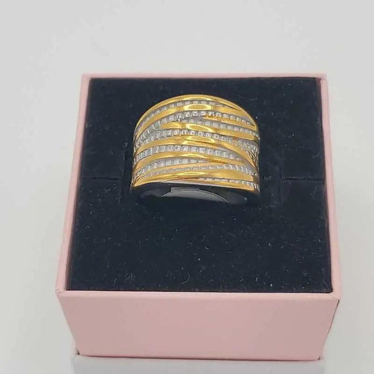 Refined Wide Ring in Gold and Silver finish, with cubic zirconia stone on a neutral background