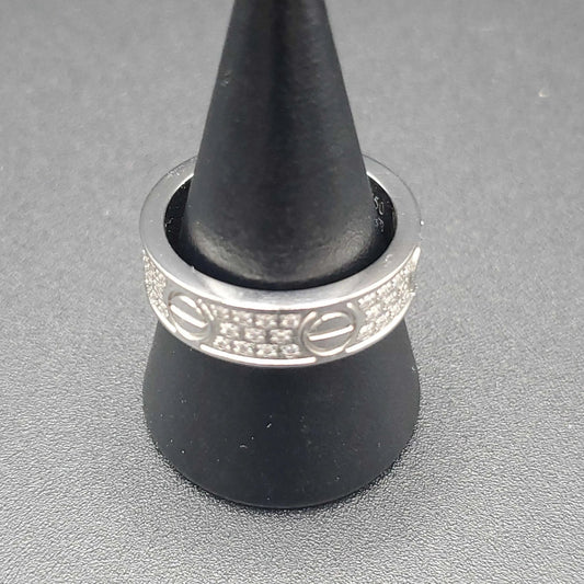 Silver Screw Ring in Silver finish, with cubic zirconia stone on a neutral background