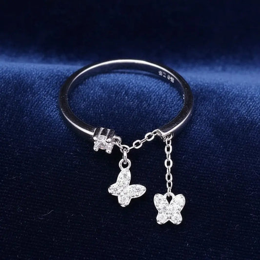 Sophisticated Butterfly Ring in Silver finish, with cubic zirconia stone on a neutral background