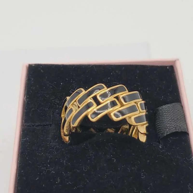 Sophisticated Enamel Ring in Gold finish on a neutral background