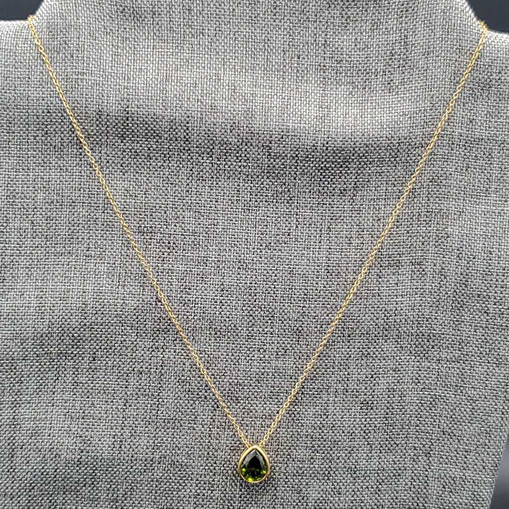 Teardrop Stone Necklace in Gold finish on a neutral background