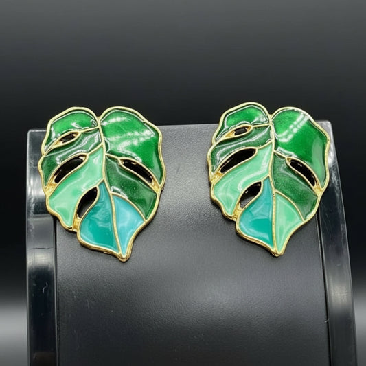 Tree Leaf Earrings in Gold finish on a neutral background