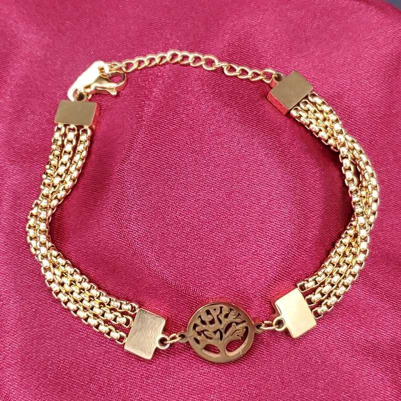 Tree of Life Bracelet in Gold finish on a neutral background