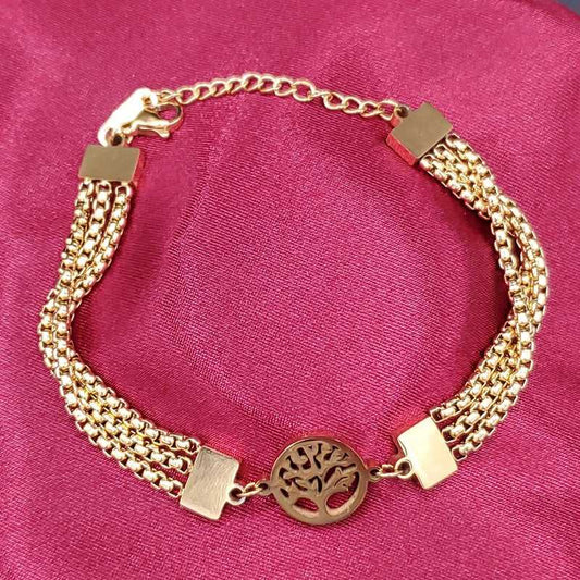 Tree of Life Bracelet in Gold finish on a neutral background