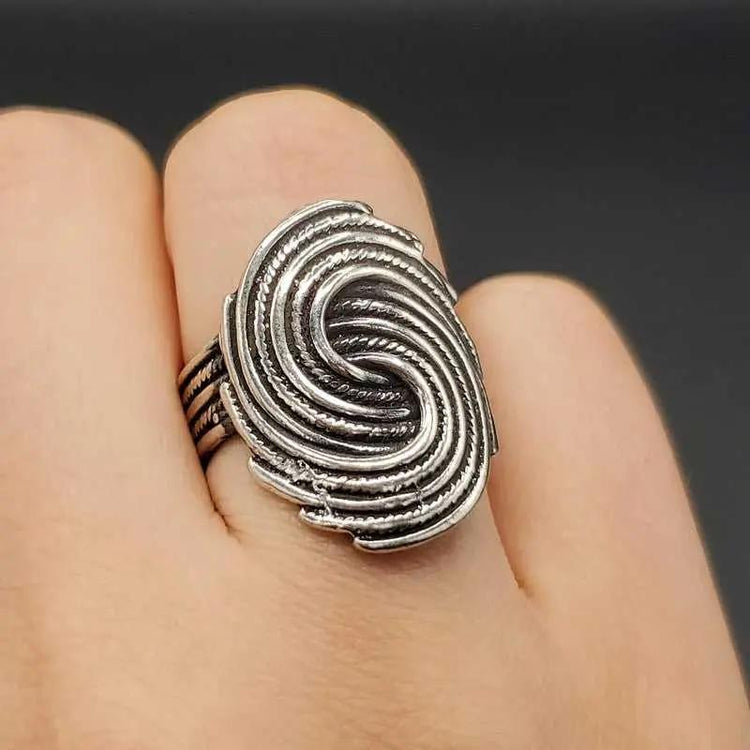 Modern Whirlpool Ring in Silver finish on a neutral background