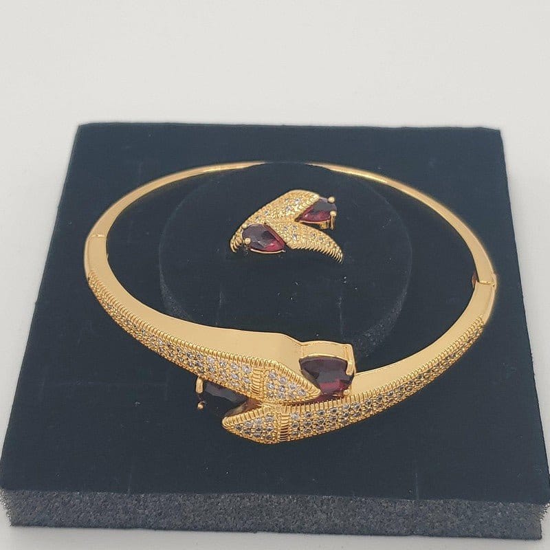 Arrow Bangle & Ring Set in Gold finish, with cubic zirconia stone on a neutral background