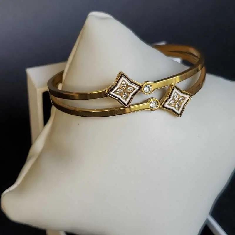 Artisanal Monogram Flower Bangles in Gold finish, with cubic zirconia stone on stones