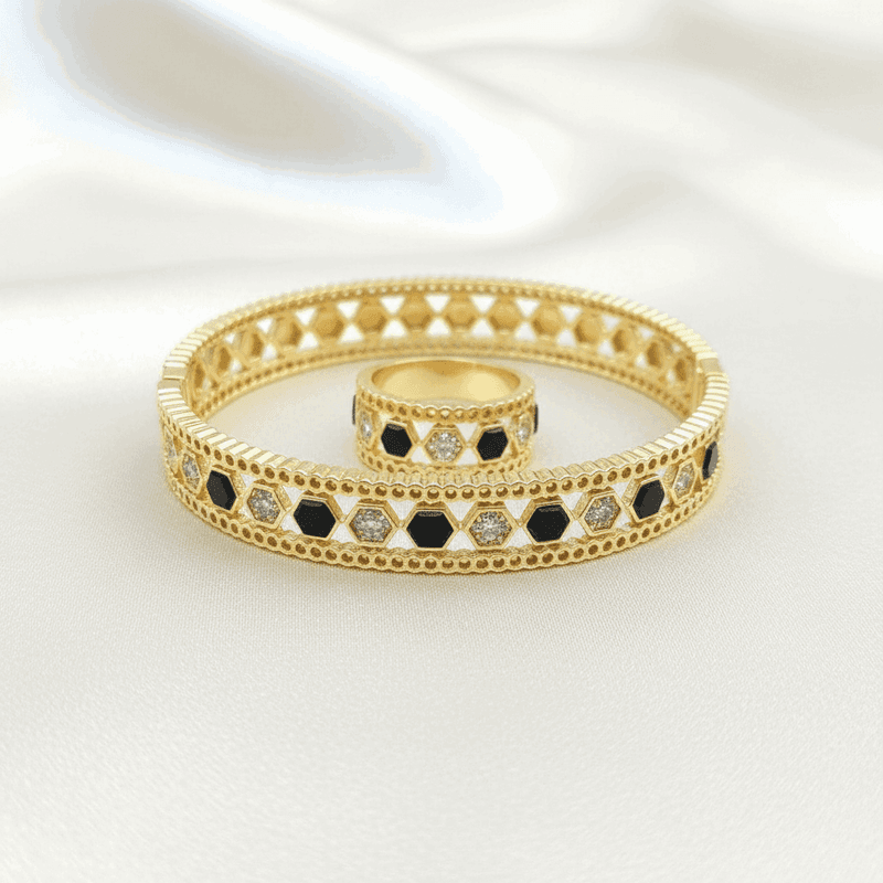 Beehive Bangle with Black Enamel and Zircons in Gold finish, with cubic zirconia stone on stones in a honeycomb pattern