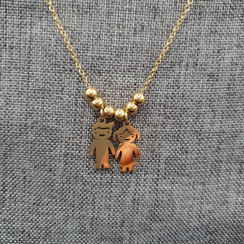 Boy & Girl Necklace in Gold finish on a neutral background