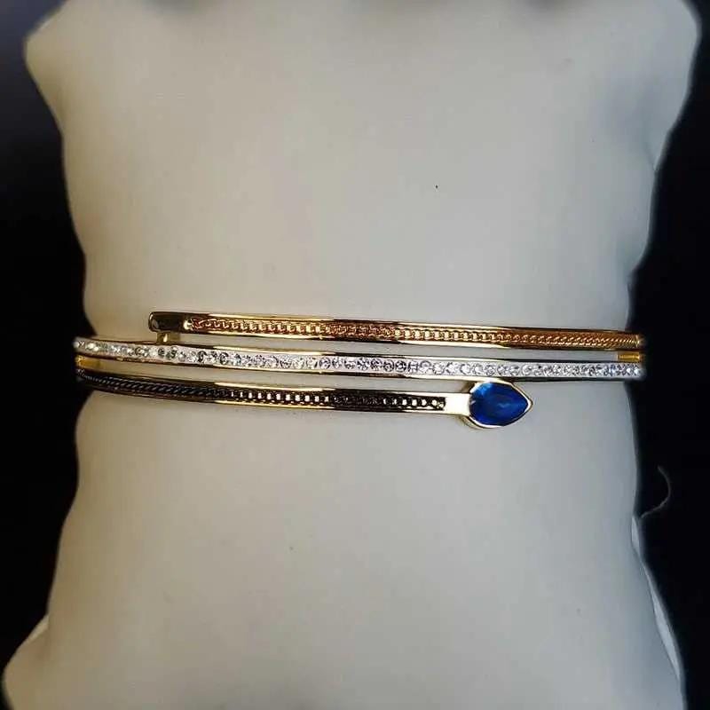 Classic Blue Teardrop Stone Bangle in Gold and Silver finish, with cubic zirconia stone on a neutral background