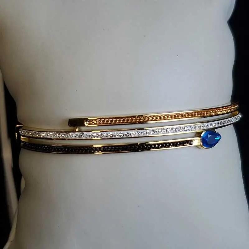 Classic Blue Teardrop Stone Bangle in Gold and Silver finish, with cubic zirconia stone on a neutral background