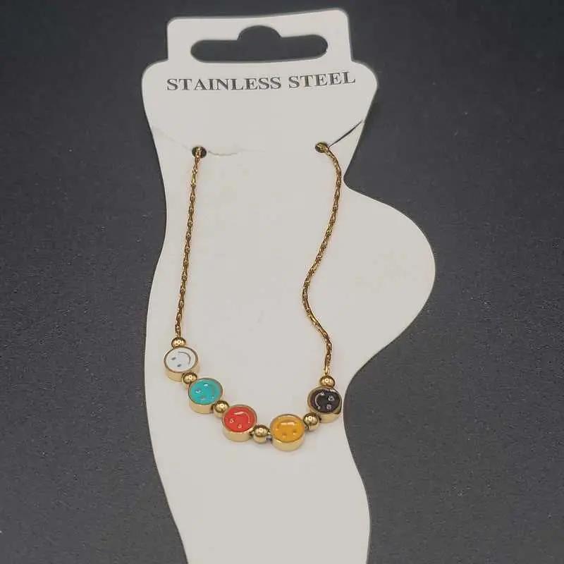 Classic Happy Face Anklet in Gold finish on a neutral background