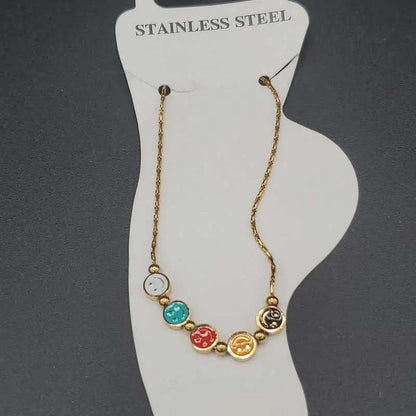 Classic Happy Face Anklet in Gold finish on a neutral background