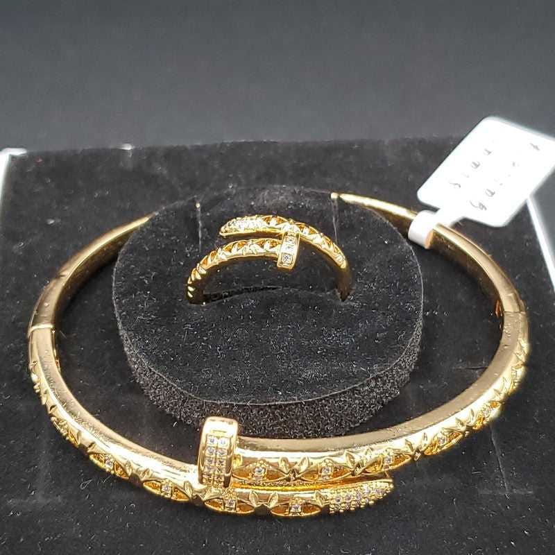 Classic Nail Bracelet & Ring Set in Gold finish, with cubic zirconia stone on a neutral background