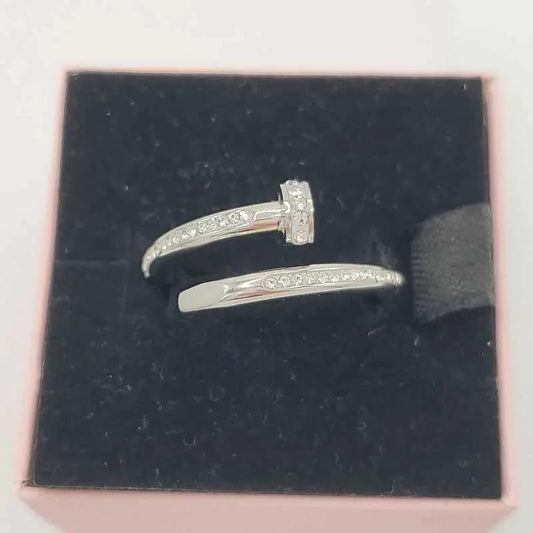 Classic Nail Ring in Silver finish, with cubic zirconia stone on a neutral background