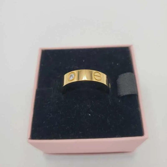 Classic Ring in Gold finish, with cubic zirconia stone on a neutral background