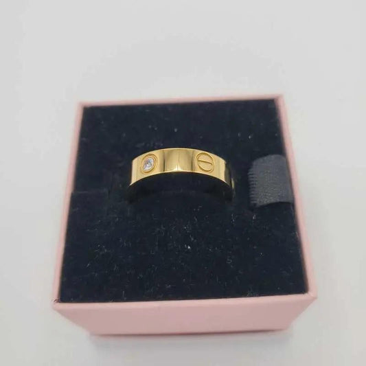 Classic Ring in Gold finish, with cubic zirconia stone on a neutral background