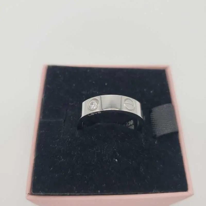 Classic Ring in Gold finish, with cubic zirconia stone on a neutral background