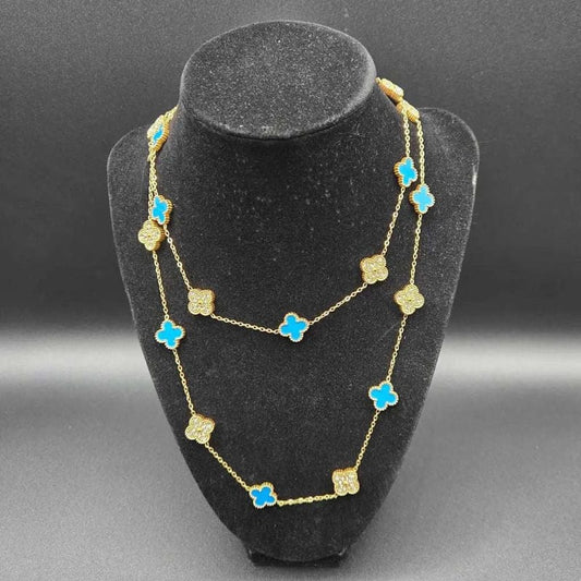 Clover Clover Necklace in Gold finish, with cubic zirconia stone on stones, modeled on a black bust