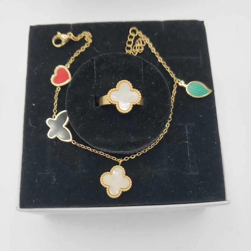 Colorful Butterfly Clover Set in Gold finish, with pearl stone on a neutral background