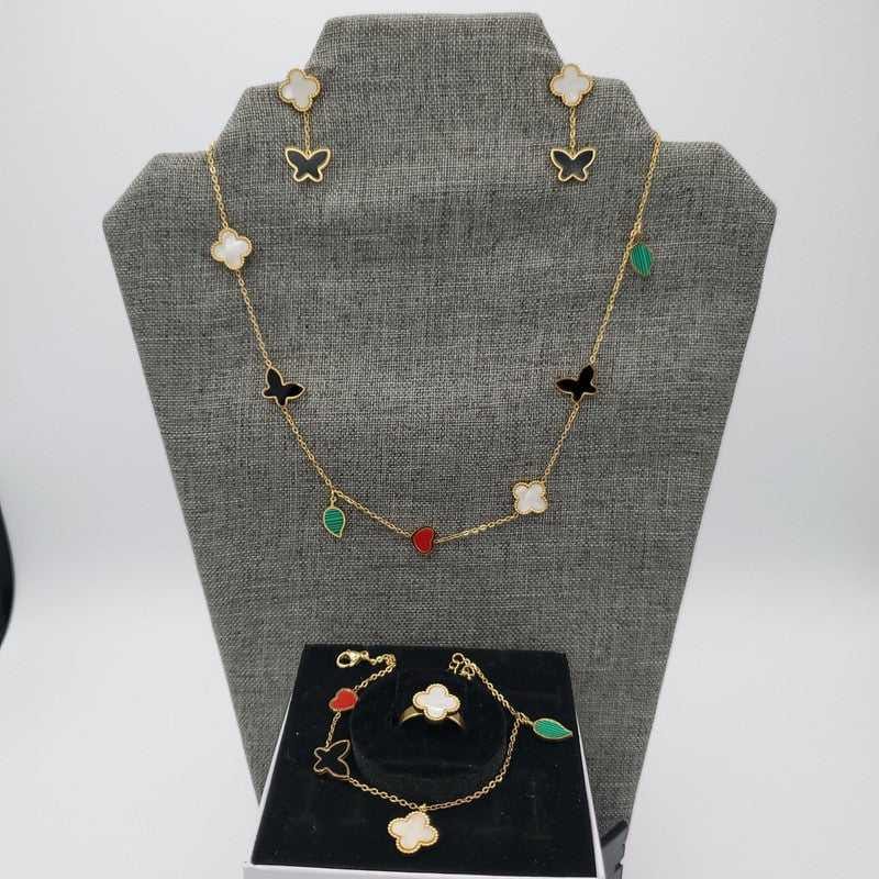Colorful Butterfly Clover Set in Gold finish, with pearl stone on a neutral background