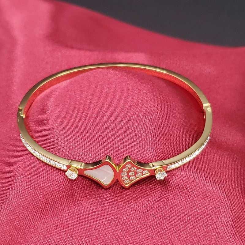 Diva's Dream Bangle in Gold finish, with cubic zirconia stone on stones and white enamel accents