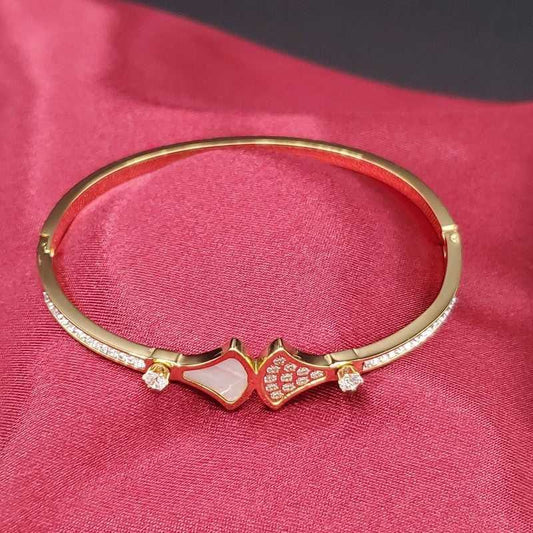 Diva's Dream Bangle in Gold finish, with cubic zirconia stone on stones and white enamel accents