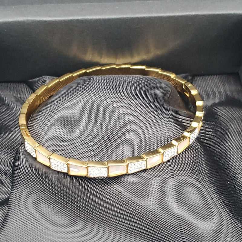 Elegant Snake Bangle in Silver finish, with cubic zirconia stone on a neutral background