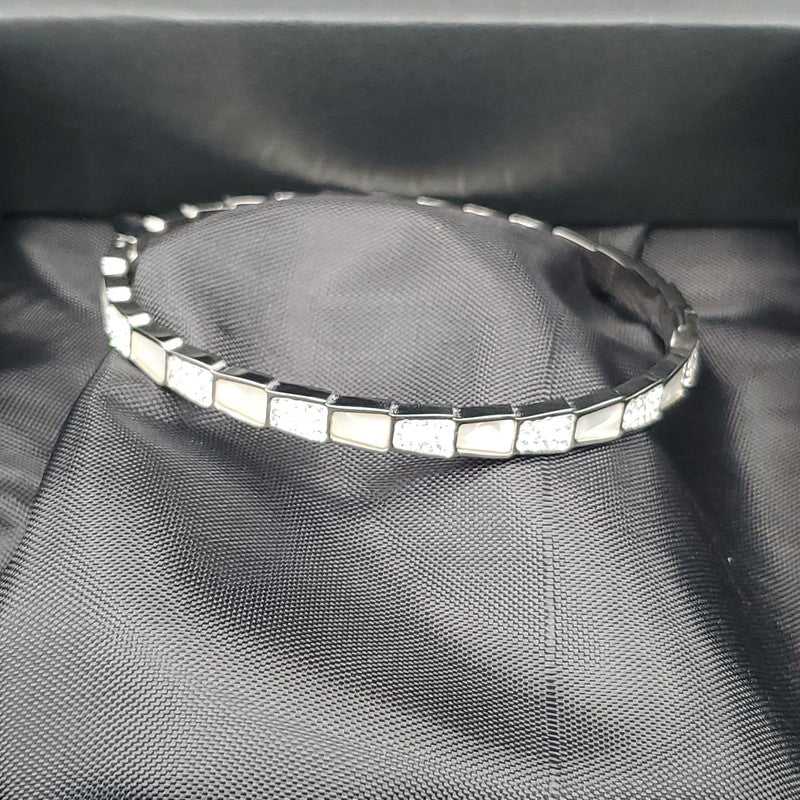 Elegant Snake Bangle in Silver finish, with cubic zirconia stone on stones and white enamel in a rectangular pattern
