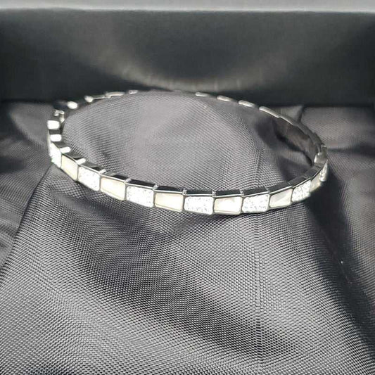 Elegant Snake Bangle in Silver finish, with cubic zirconia stone on stones and white enamel in a rectangular pattern
