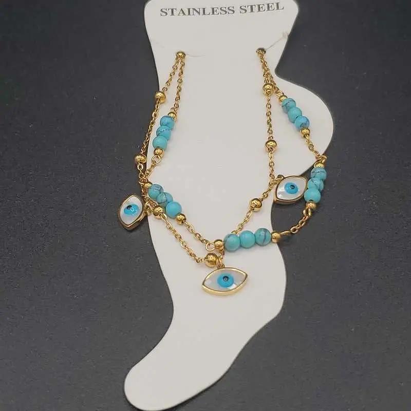 Evil Eye Anklet in Gold finish, with turquoise stone on a neutral background