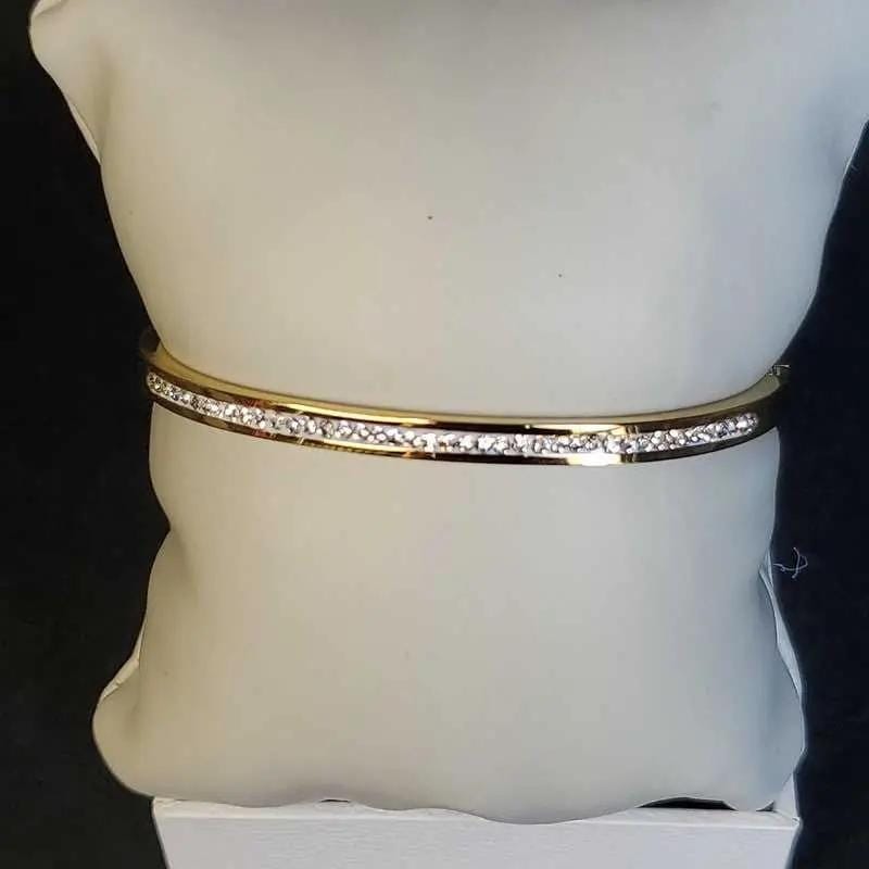 Exquisite Lovely Bangle in Gold finish, with cubic zirconia stone on stones