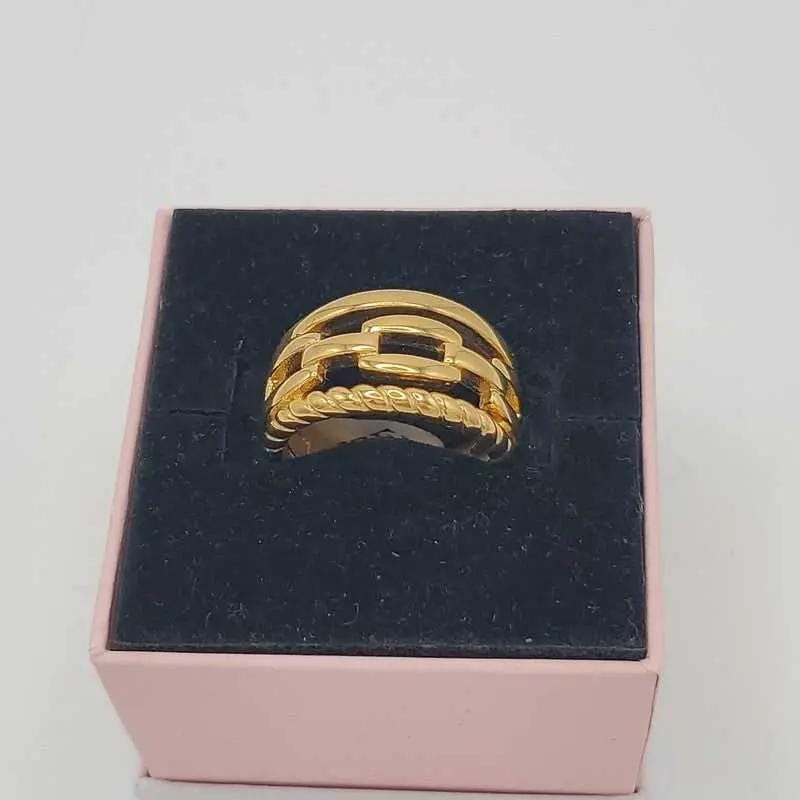 Golden Chain Ring in Gold finish on a neutral background