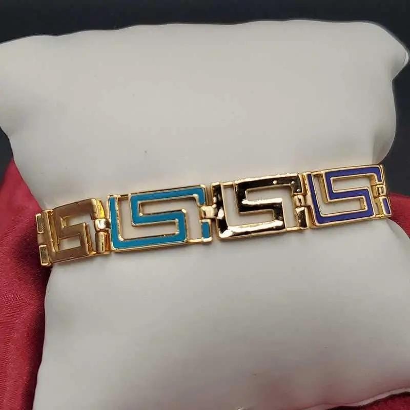 Greek Key Bracelet in Gold finish on a neutral background