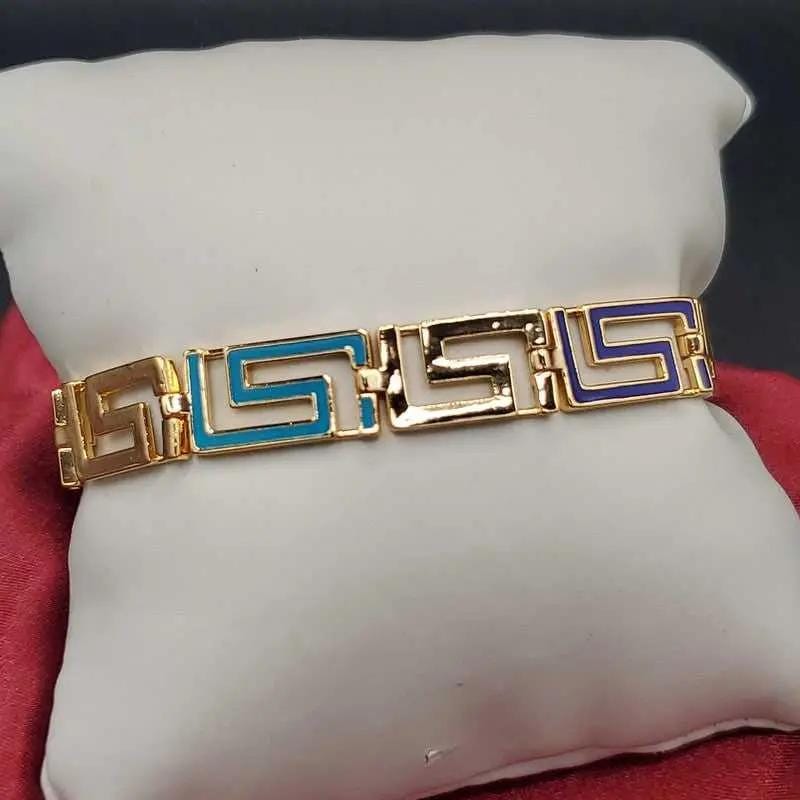 Greek Key Bracelet in Gold finish on a neutral background