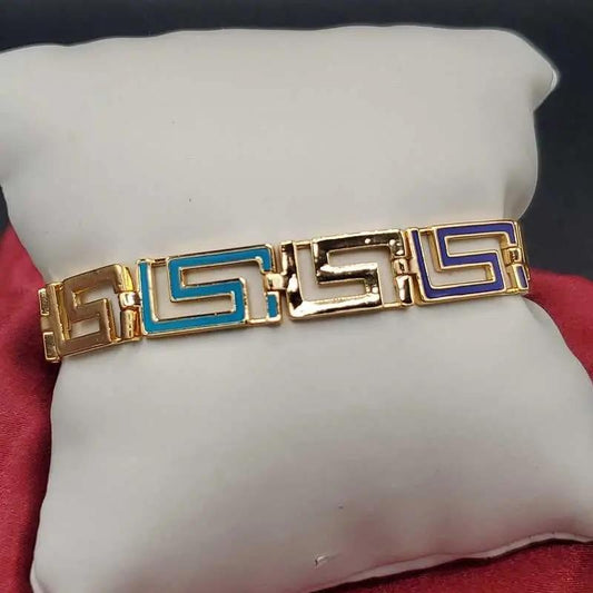 Greek Key Bracelet in Gold finish on a neutral background