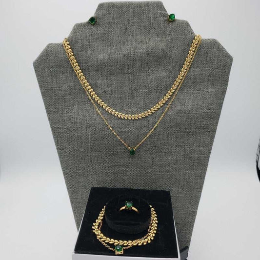Green Stone Jewelry Sets in Gold finish on a neutral background