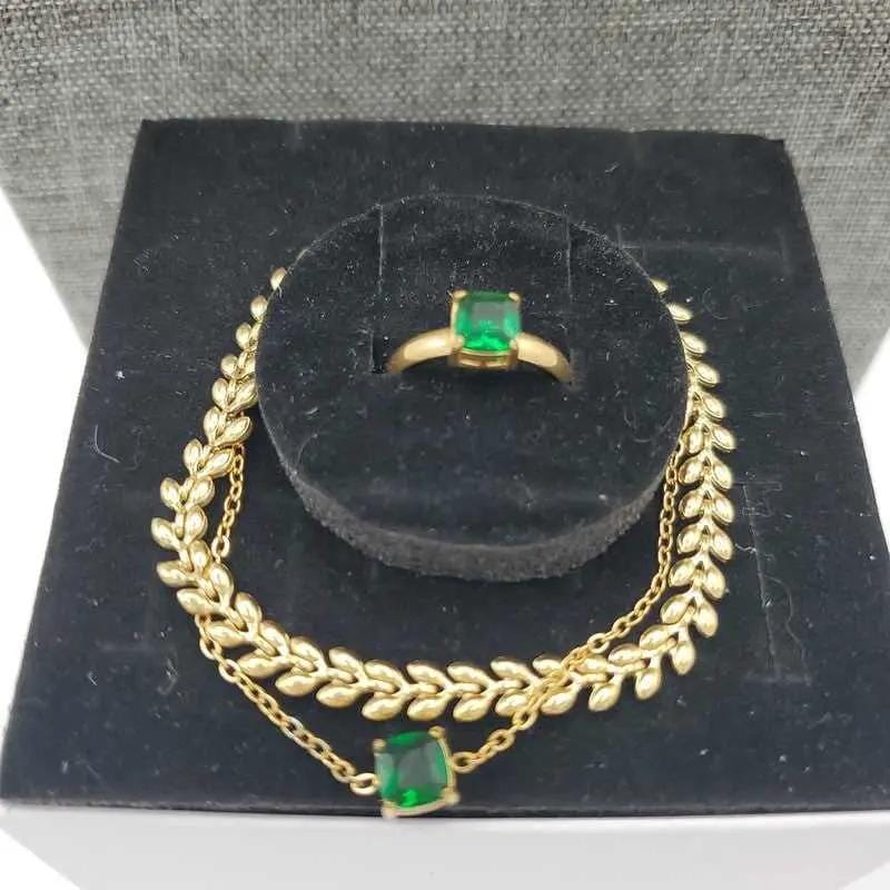 Green Stone Jewelry Sets in Gold finish on a neutral background