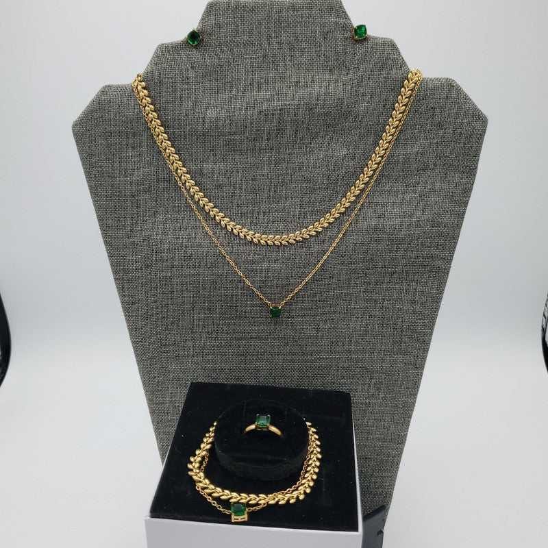 Green Stone Jewelry Sets in Gold finish on a neutral background