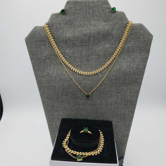 Green Stone Jewelry Sets in Gold finish on a neutral background